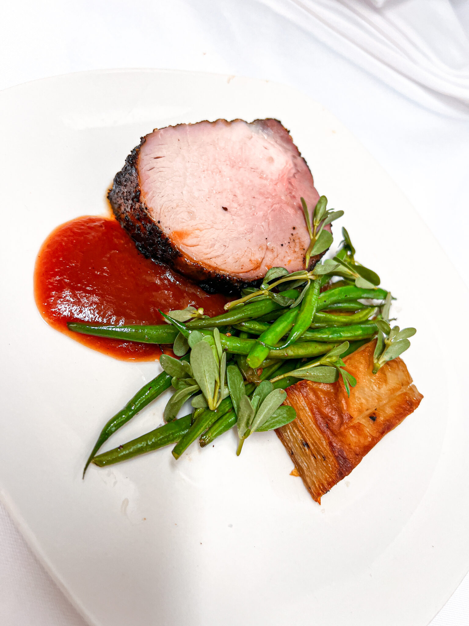 Coffee Rubbed Pork Loin-Potato Pavé-Haricot Verts-Peach BBQ Sauce